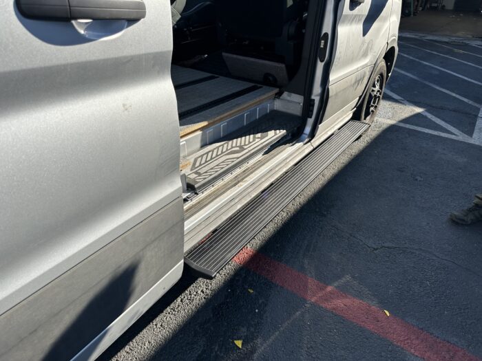 2024 Ford Transit Van Electric PowerStep Amp Research passenger side or driver short side This is an image of the product for sale, that shows how it is utilized from a different angle