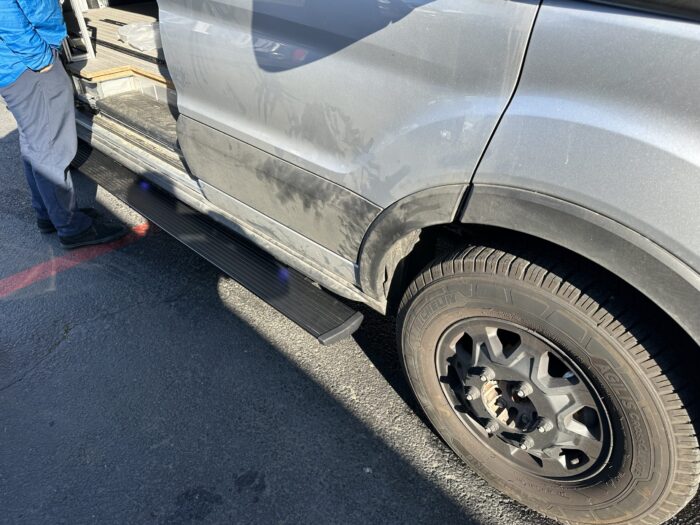 2024 Ford Transit Van Electric PowerStep Amp Research passenger side This is an image of the product for sale, that shows how it is utilized from a different angle